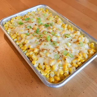 a tray of corn and cheese