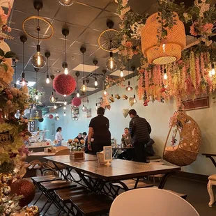 people sitting at tables in a restaurant
