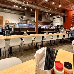 people sitting at tables in a restaurant
