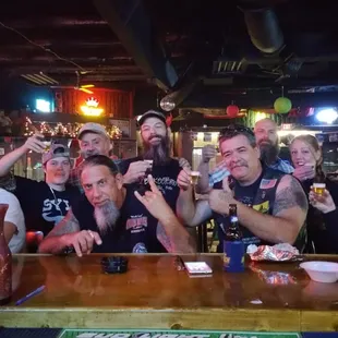 a group of people sitting at a bar