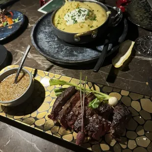 Wagyu steak, it goes very well with the sauce. Whipped potatoes.