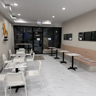 a restaurant with tables and chairs