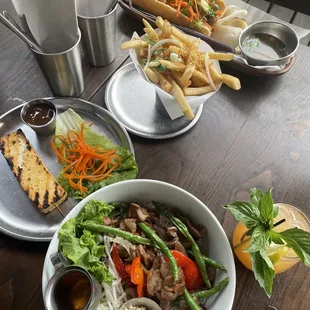 Top: Chicken Banh Mi Middle: Truffle Fries Bottom: Pork Bun Bowl Bottom Left: Street Tofu