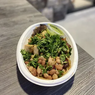 Regular with Sweet Potato Nood Base, power beans, balsamic shrooms, and miso tofu with cilantro pesto - all vegan.