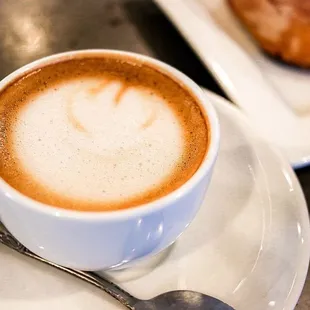 a cappuccino and a croissant