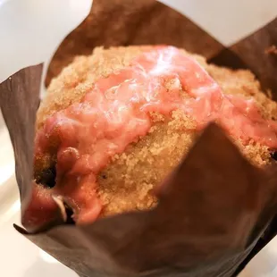 a muffin in a paper wrapper