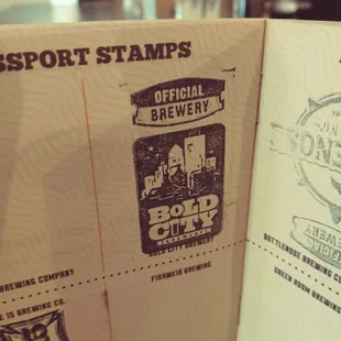 a passport stamp and a beer