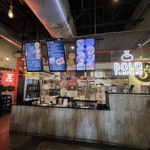 a restaurant counter and menus