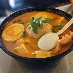 Spicy ramen soup with tons of dumplings