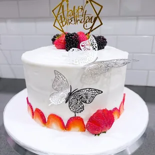 Chantilly birthday cake with custom topper and silver butterflies