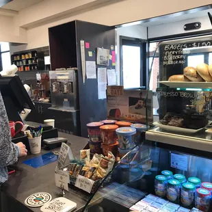 a woman standing in a coffee shop