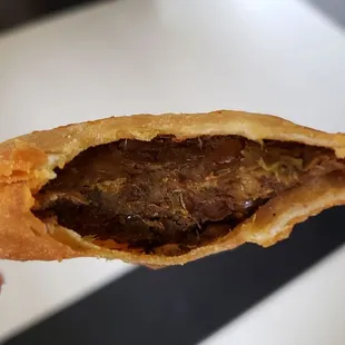 Interior of veggie sambusa ($6). Weird flavor to pastry shell. Dry interior. Not good.