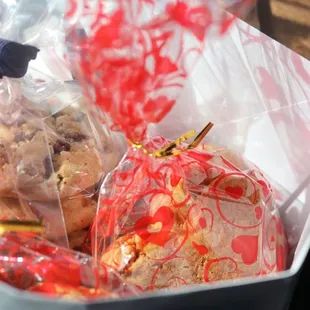 a container of cookies and a bag of cookies