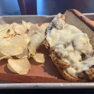 Chicken sub with onions and mushroom. (Note: seemed like processed chicken)