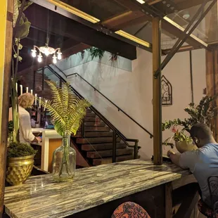a man sitting at a bar in a restaurant