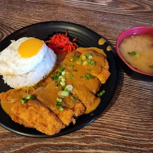a plate of food and a bowl of soup