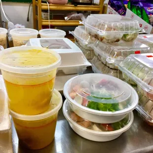 a variety of containers of food