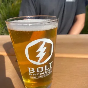 a glass of beer on a table