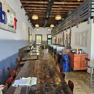 the inside of a restaurant with tables and chairs