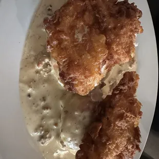 Biscuits and gravy with hand breaded fried chicken