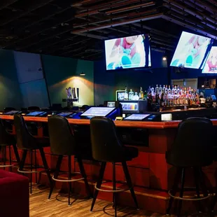 a bar with multiple screens