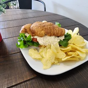 Tuna salad sandwich on a croissant.