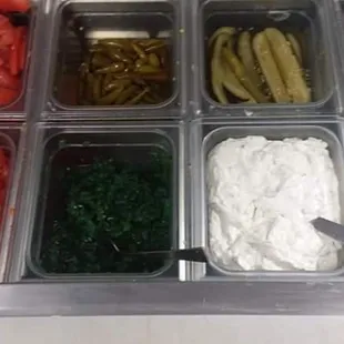 a variety of vegetables in containers