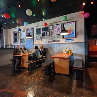 people sitting at tables in a restaurant