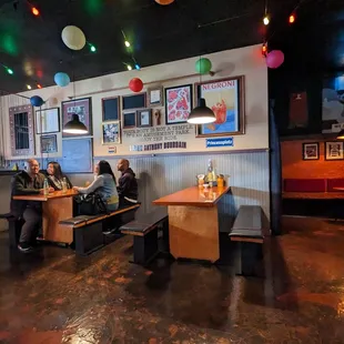 people sitting at tables in a restaurant