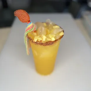 Tropic Thunder!  homemade with pineapple and mango topped with rim dip, tajin and candy