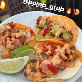 Shrimp tacos topped with pico de gallo and homemade chipotle aioli. Get them with the Bomb taco package