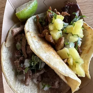 Carne asada and Al pastor tacos