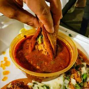 Birria tacos taking a consomme bath