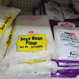 a shelf of flour and flour bags