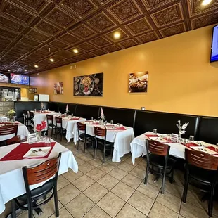 a restaurant with tables and chairs