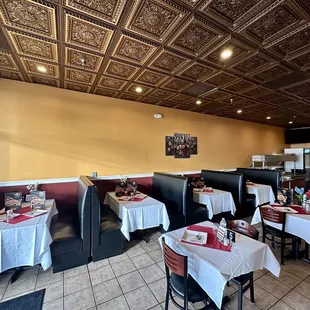 a dining area with tables and chairs