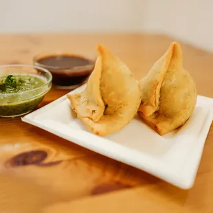 a plate of saman and dipping sauce