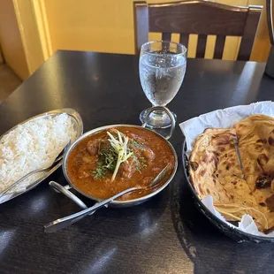 Lamb vindaloo. Whole what roti bread.