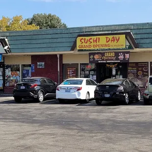 cars parked in front of the restaurant