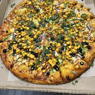 Half and half: 16. Shahi Paneer Pizza and 13. Paneer Tikka Pizza