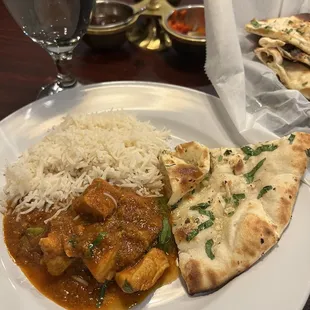 Garlic naan bread, rice and chicken curry