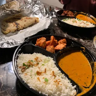 a close up of a plate of indian food