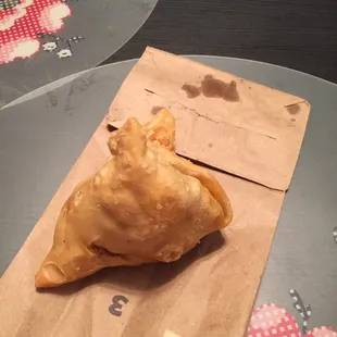 a pastry on a paper bag