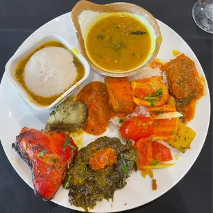 Buffet food - idli sambar, dal tadka, chicken curry, aloo capsicum, saag paneer, paneer tikka masala, tandoori chicken, hariyali chicken