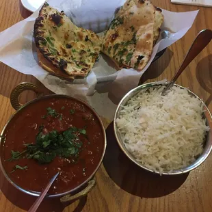 Lamb curry with white rice and garlic naan bread.