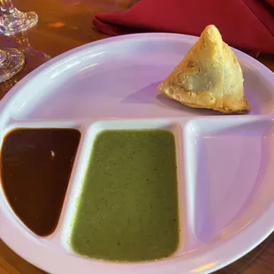 Tamarind (dark) and mint chutney (green)