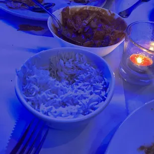 a plate of food and a bowl of rice