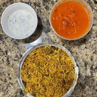 ig: @whatsviveating  |  butter chicken (makhani), goat biryani, and raita