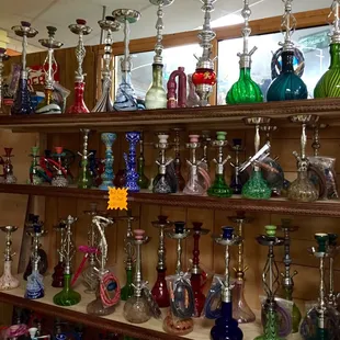 a shelf full of glass items