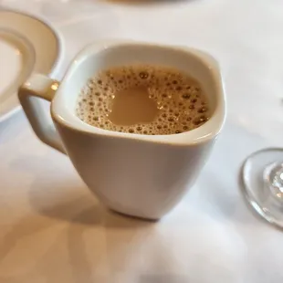 a cup of coffee on a table